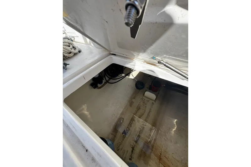  Yacht Photos Pics Open storage compartment in 2015 Edgewater 320CC boat, showing interior details.
