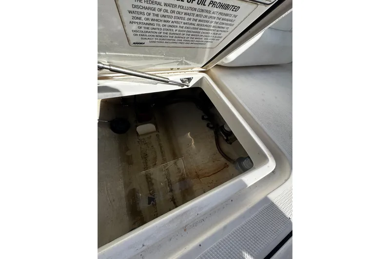  Yacht Photos Pics Open hatch on 2015 Edgewater 320CC boat showing interior compartment.