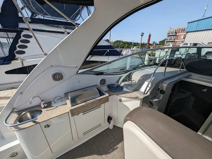 So Lucky Yacht Photos Pics 2015 Sea Ray 330 Sundancer boat interior with kitchenette and seating area.