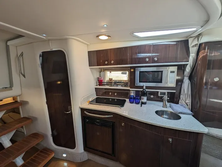 So Lucky Yacht Photos Pics Interior of 2015 Sea Ray 330 Sundancer yacht kitchen with modern amenities.