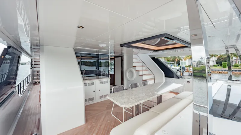 Pinch Me Yacht Photos Pics Luxurious interior of 2021 Ocean Alexander 28R yacht with modern dining area.