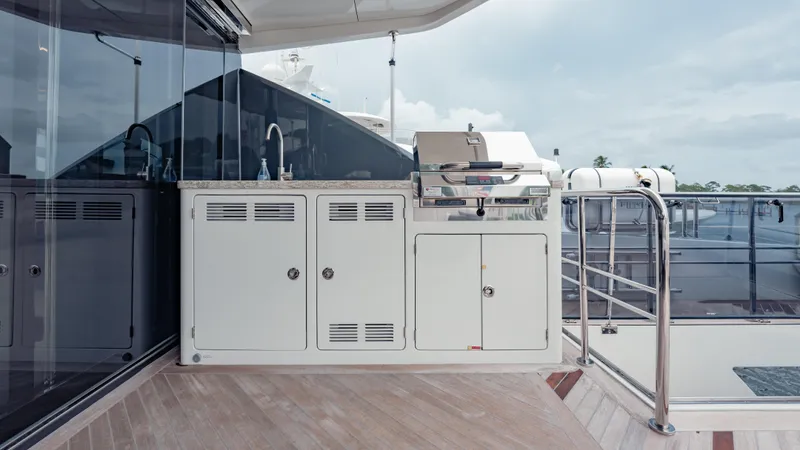 Pinch Me Yacht Photos Pics Outdoor kitchen on 2021 Ocean Alexander 28R yacht with grill and sink.