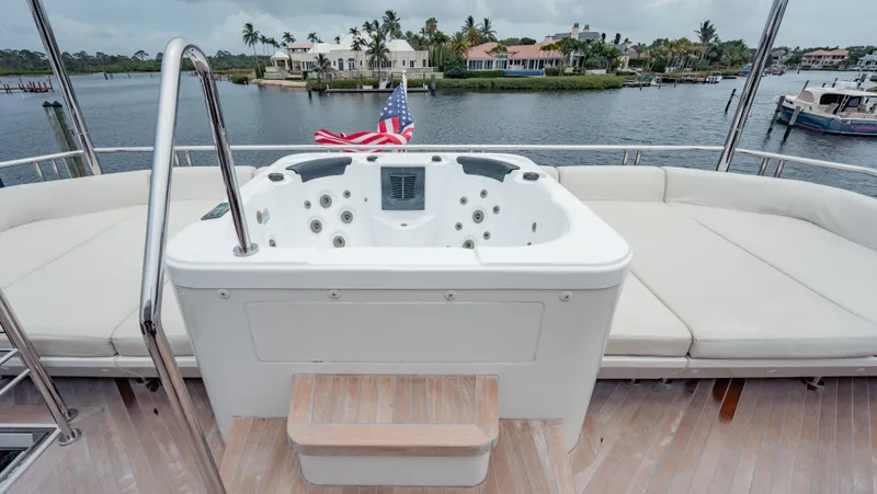 Pinch Me Yacht Photos Pics Luxurious Ocean Alexander 28R yacht deck with jacuzzi, 2021 model, overlooking waterfront homes.