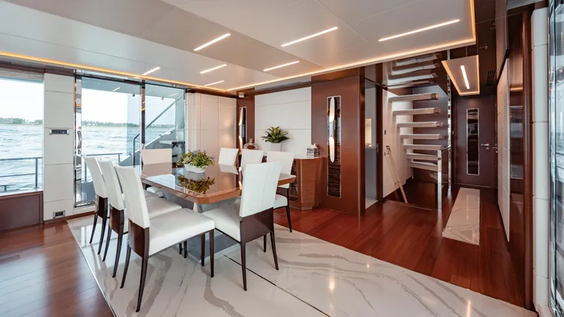 Pinch Me Yacht Photos Pics Luxurious dining area on 2021 Ocean Alexander 28R yacht with modern decor and ocean view.