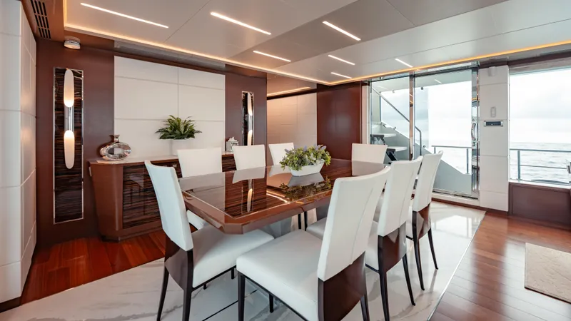 Pinch Me Yacht Photos Pics Luxurious dining area on 2021 Ocean Alexander 28R yacht with elegant decor and ocean view.