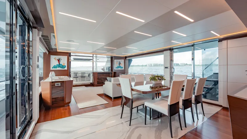 Pinch Me Yacht Photos Pics Luxurious interior of 2021 Ocean Alexander 28R yacht with elegant dining area and ocean views.