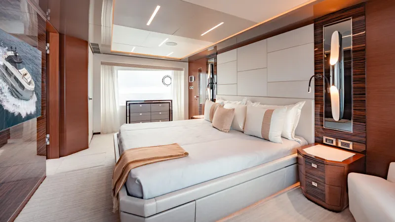Pinch Me Yacht Photos Pics Luxurious bedroom interior of 2021 Ocean Alexander 28R yacht, featuring elegant design and ocean view.