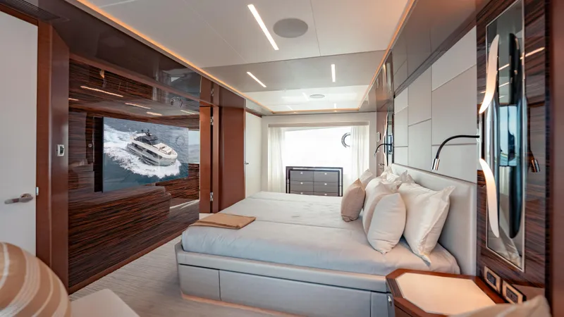 Pinch Me Yacht Photos Pics Luxurious bedroom interior of 2021 Ocean Alexander 28R yacht with modern design elements.