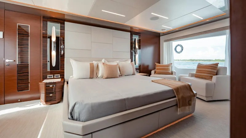 Pinch Me Yacht Photos Pics Luxurious bedroom interior of 2021 Ocean Alexander 28R yacht with modern design and ocean view.