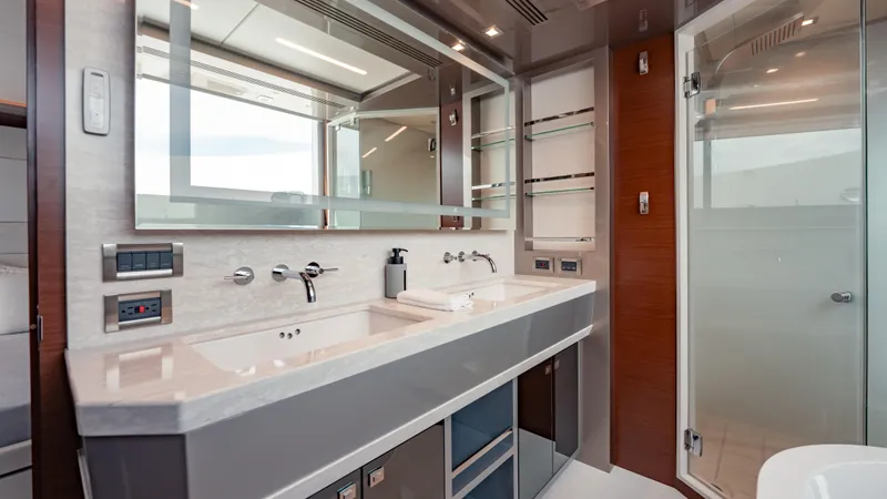 Pinch Me Yacht Photos Pics Luxurious bathroom in 2021 Ocean Alexander 28R yacht with modern fixtures and elegant design.