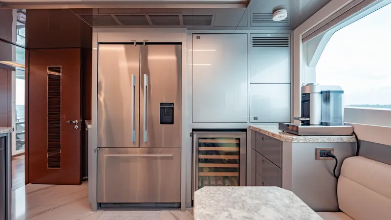 Pinch Me Yacht Photos Pics Luxurious kitchen interior on 2021 Ocean Alexander 28R yacht with modern appliances.