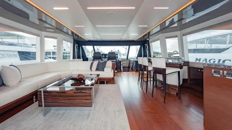 Pinch Me Yacht Photos Pics Luxurious interior of 2021 Ocean Alexander 28R yacht with modern furnishings and panoramic windows.