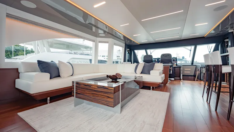 Pinch Me Yacht Photos Pics Luxurious interior of 2021 Ocean Alexander 28R yacht with modern furnishings and panoramic windows.