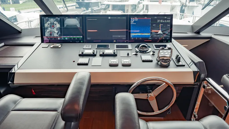 Pinch Me Yacht Photos Pics Helm of 2021 Ocean Alexander 28R yacht with advanced navigation controls and displays.