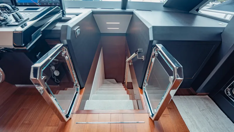 Pinch Me Yacht Photos Pics Staircase on 2021 Ocean Alexander 28R yacht with modern design and glass doors.