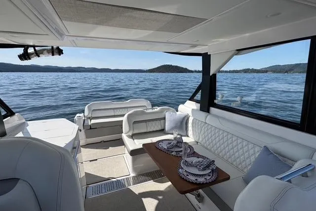  Yacht Photos Pics Luxurious interior of 2021 Regal 36 Grande Coupe yacht with scenic ocean view.