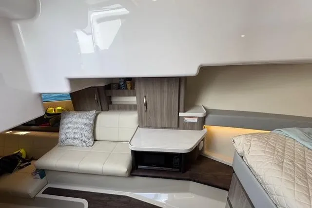 Yacht Photos Pics 2021 Regal 36 Grande Coupe interior with modern seating and cabinetry.