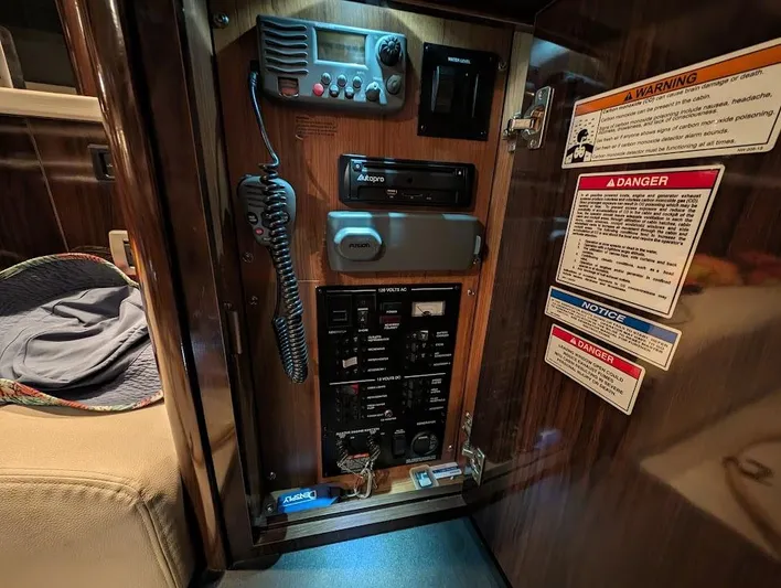 So Lucky Yacht Photos Pics Control panel of a 2015 Sea Ray 330 Sundancer boat with various switches and warning labels.