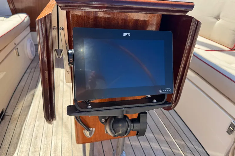  Yacht Photos Pics Touchscreen navigation panel on 2018 Leonardo Yachts Eagle 44 sailboat, wooden helm background.