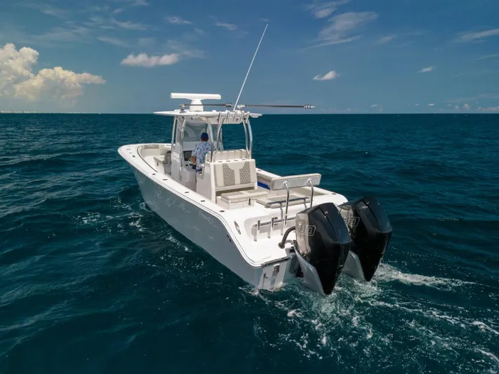  Yacht Photos Pics 2026 Front Runner 33 Center Console boat cruising on open ocean waters.