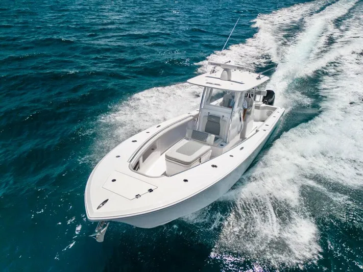  Yacht Photos Pics 2026 Front Runner 33 Center Console boat cruising on open blue water.