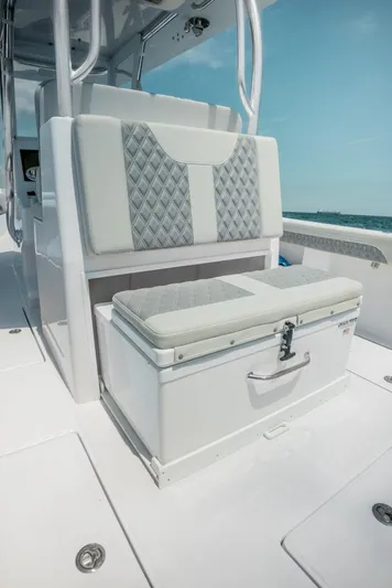  Yacht Photos Pics 2026 Front Runner 33 Center Console boat interior with cushioned seating and storage.