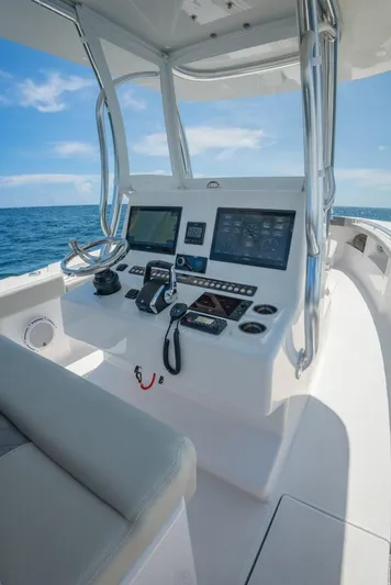  Yacht Photos Pics 2026 Front Runner 33 Center Console boat dashboard with modern navigation equipment on open sea.