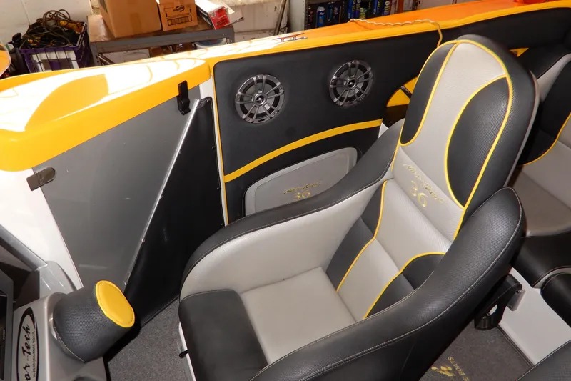  Yacht Photos Pics 2008 Nor-Tech 3600 Supercat interior with black and yellow seating and audio speakers.