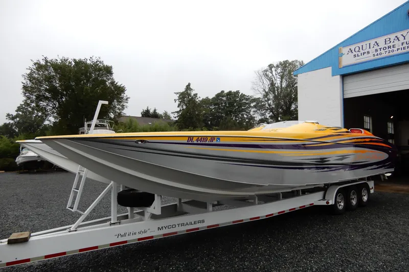  Yacht Photos Pics 2008 Nor-Tech 3600 Supercat powerboat on trailer, vibrant yellow and orange design.