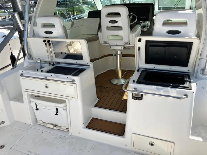  Yacht Photos Pics 2009 Boston Whaler 345 Conquest boat interior with seating and storage compartments.