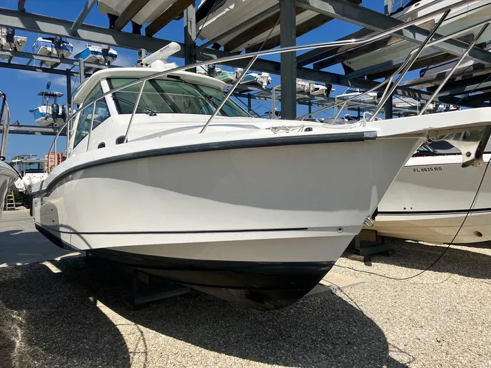  Yacht Photos Pics 2009 Boston Whaler 345 Conquest boat in storage, side view.