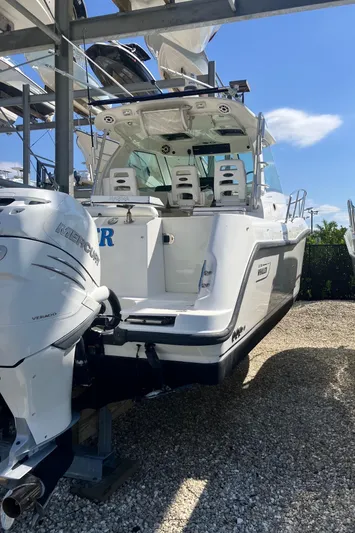  Yacht Photos Pics 2009 Boston Whaler 345 Conquest boat on dry dock, featuring powerful outboard engines.