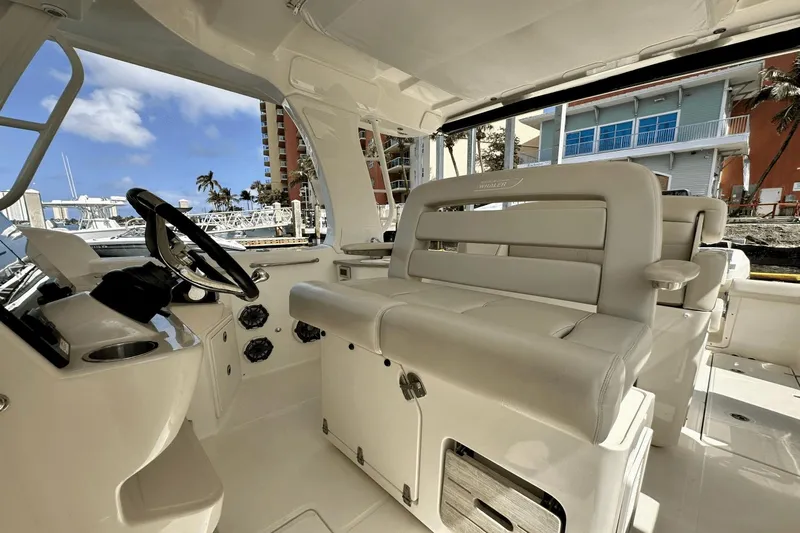  Yacht Photos Pics 2019 Boston Whaler 350 Realm interior with luxurious seating and modern helm.