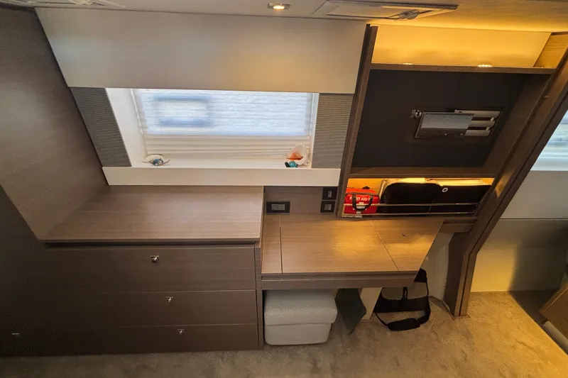  Yacht Photos Pics Interior of 2022 Leopard 42 yacht with modern desk and storage space.
