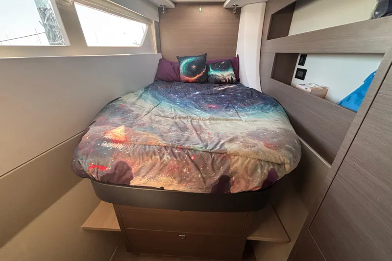  Yacht Photos Pics Cozy bedroom in 2022 Leopard 42 yacht with galaxy-themed bedding.