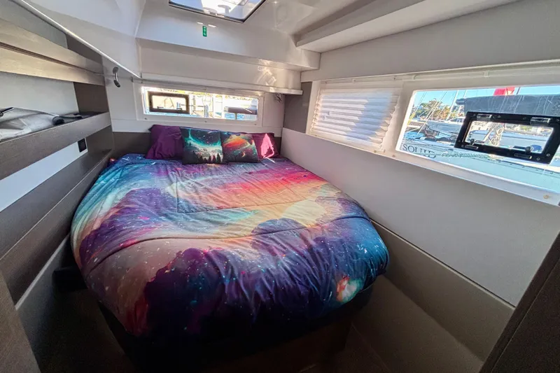  Yacht Photos Pics Cozy bedroom in 2022 Leopard 42 yacht with galaxy-themed bedding.