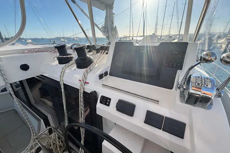  Yacht Photos Pics Cockpit of 2022 Leopard 42 catamaran with navigation controls and winches, docked at marina.