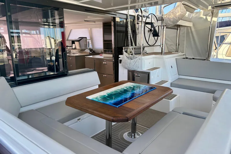  Yacht Photos Pics Luxurious interior of 2022 Leopard 42 catamaran with modern seating and elegant table.