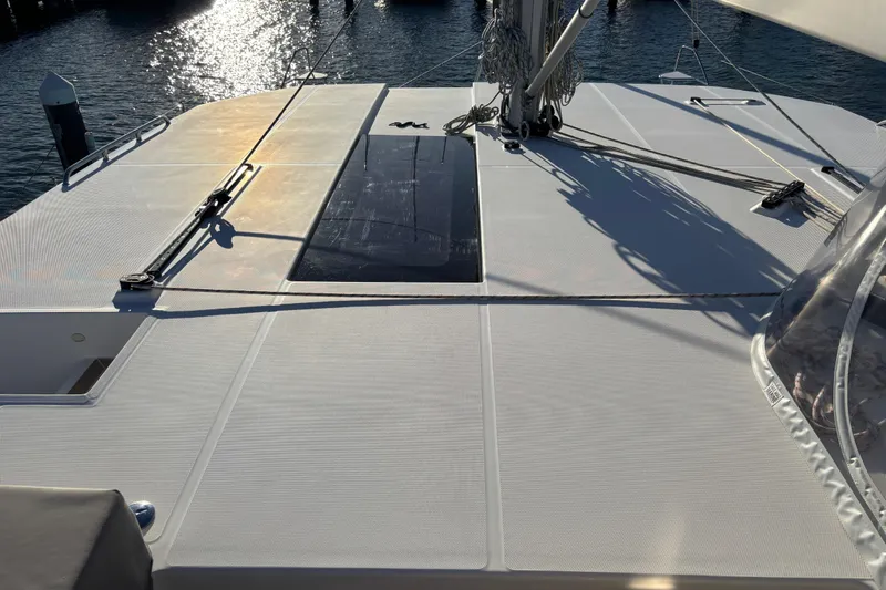  Yacht Photos Pics 2022 Leopard 42 yacht deck with sunlight reflecting on the water.