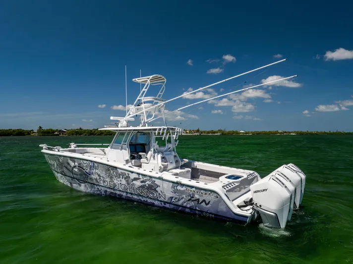  Yacht Photos Pics 2023 Freeman 37 VH boat on green water under clear blue sky.