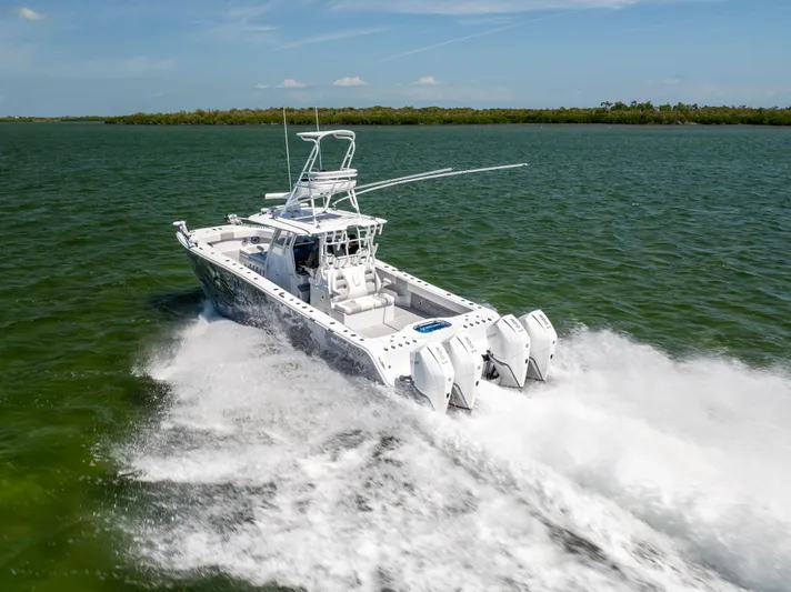  Yacht Photos Pics Freeman 37 VH 2023 boat cruising on open water, showcasing powerful engines and sleek design.