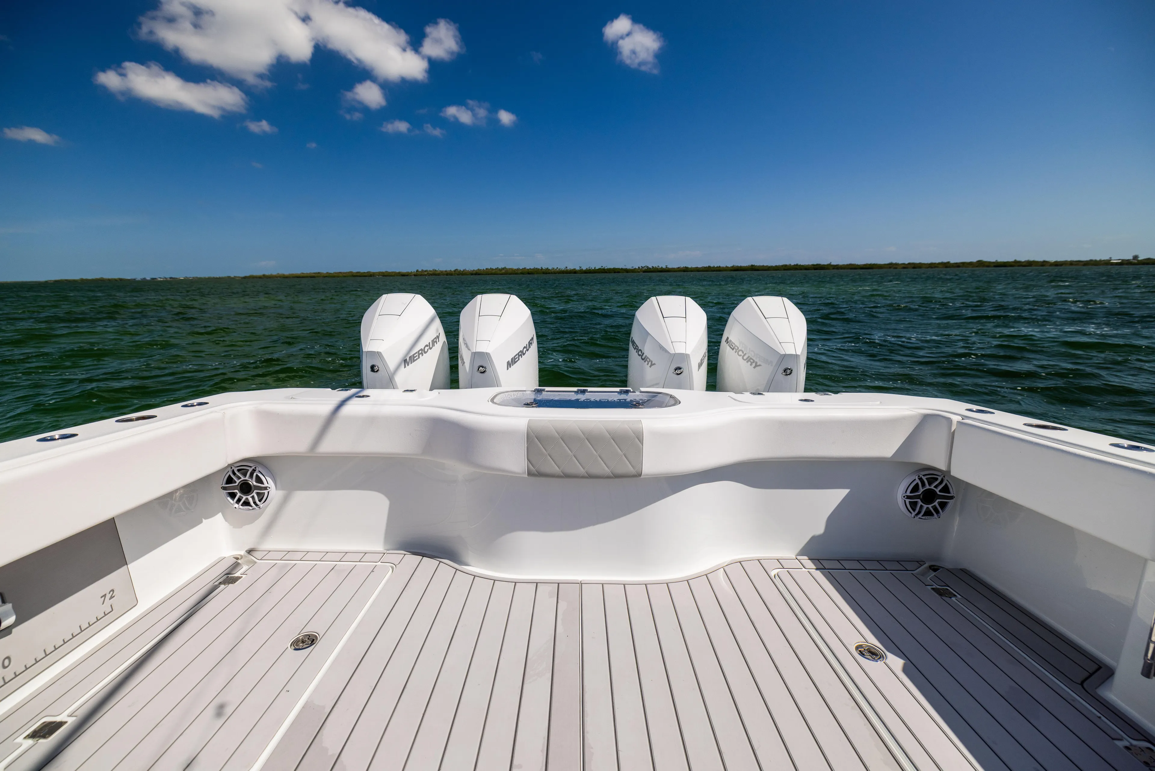  Yacht Photos Pics Freeman 37 VH 2023 boat deck with four engines, on open water under blue sky.