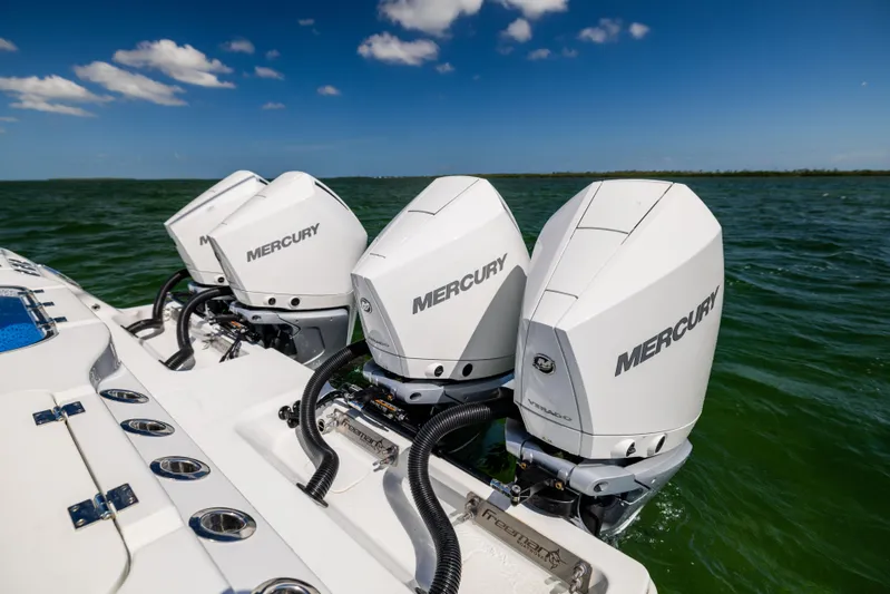  Yacht Photos Pics Triple Mercury outboard engines on a 2023 Freeman 37 VH boat in open water.