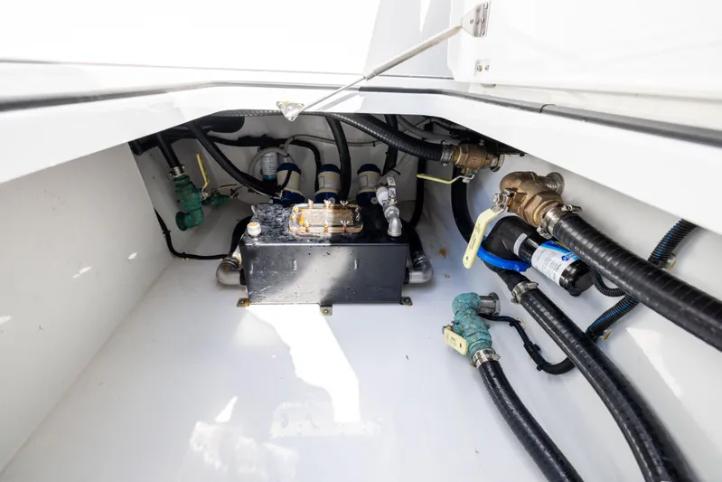  Yacht Photos Pics Freeman 37 VH 2023 boat engine compartment with hoses and mechanical components.