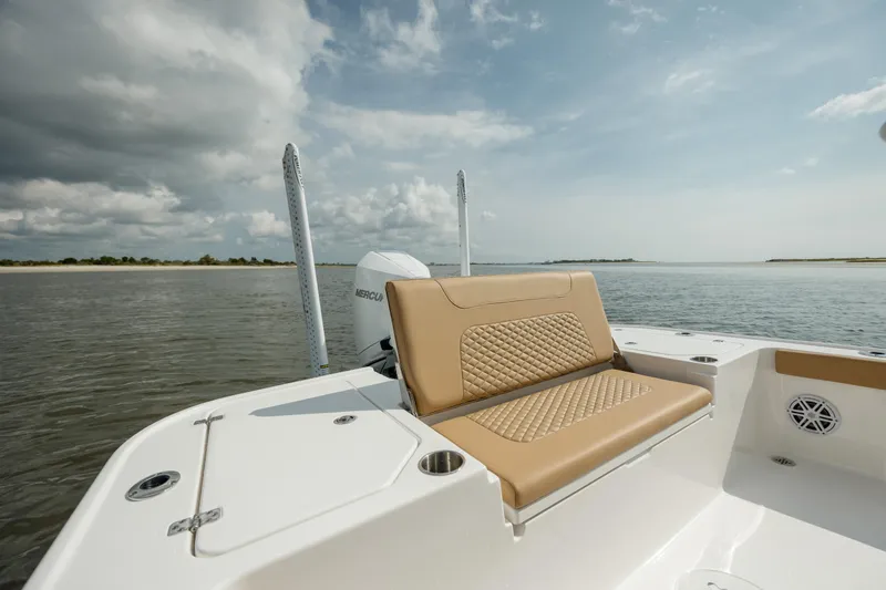 Yacht Photos Pics 2025 Caymas 26 HB boat with tan seating on calm water.