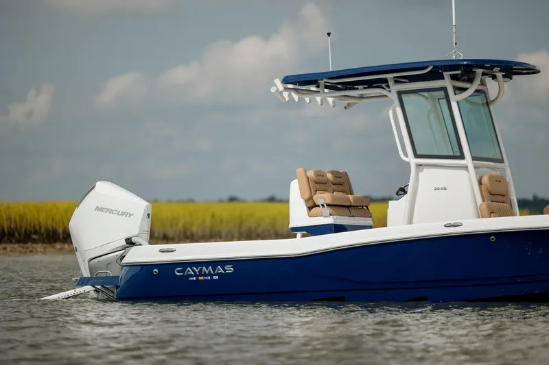  Yacht Photos Pics 2025 Caymas 26 HB boat on water, featuring a sleek blue and white design.