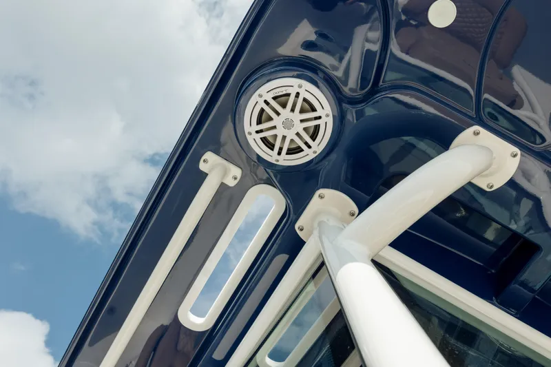  Yacht Photos Pics Close-up of 2025 Caymas 26 HB boat speaker and structure against blue sky.