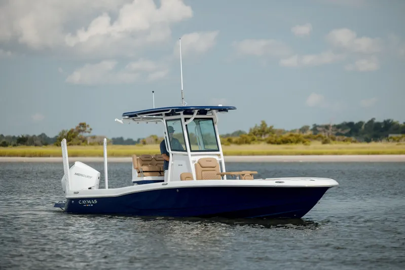  Yacht Photos Pics 2025 Caymas 26 HB boat on calm water, clear sky background.
