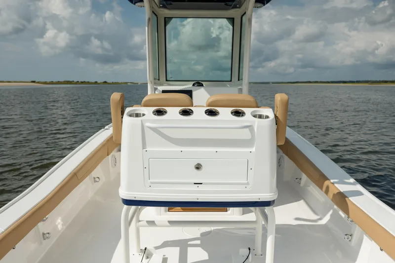  Yacht Photos Pics 2025 Caymas 26 HB boat interior with console and seating on calm water.