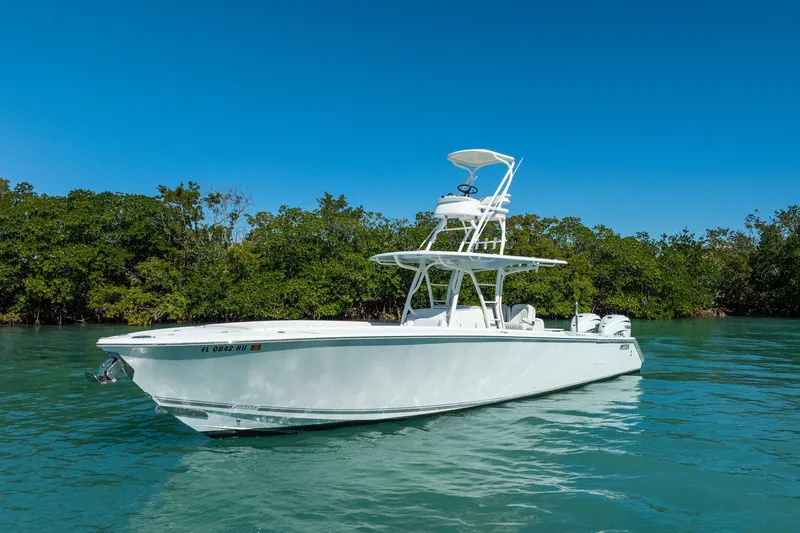  Yacht Photos Pics 2019 Jupiter 38 HFS boat on clear water with lush green background.